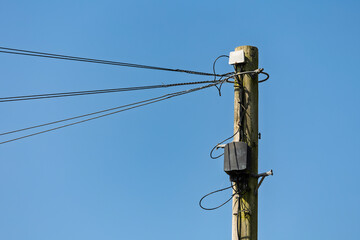 Telecommunication Utility Pole Against a Clear Blue Sky