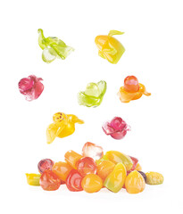 Various fruit shaped gummies on a white background