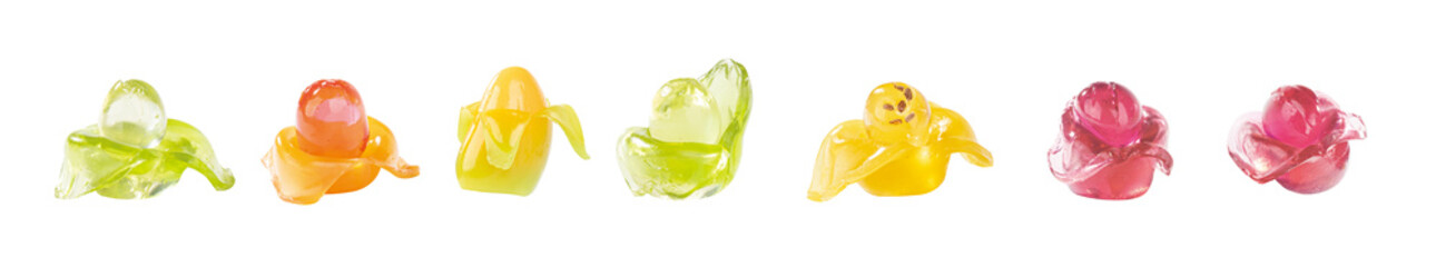 Various fruit shaped gummies on a white background