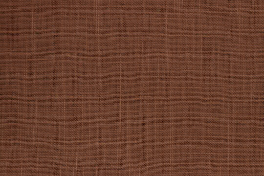 Dark brown linen fabric cloth texture background, seamless pattern of natural textile.