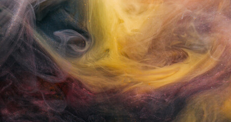 Smoke splash. Steam flow. Black yellow golden pigment dissolve in water. Glitter abstract ink blend grunge color cloud blur background.