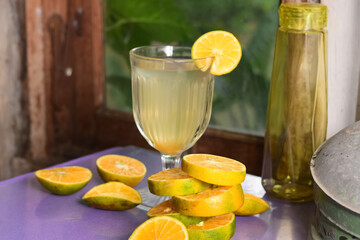 glass of champagne with lemon and lime