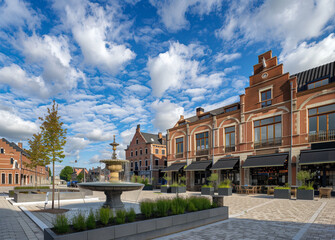  Beautiful town square with ornate fountain and blue sky