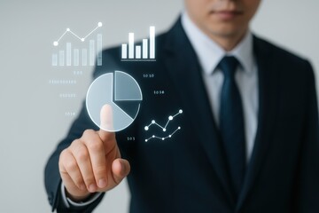 Business professional interacting with digital data visualization charts and graphs for analysis and decision making in modern office environment