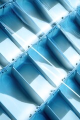 Obraz premium Innovative Flood Barrier Structure Detail with Blue Metallic Texture Symbolizing Urban Resilience and Sustainability in Modern Infrastructure Design