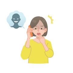 怪しい人物からの電話に出る女性