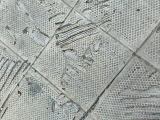 Distressed White Dotted Tiles with Scratches and Grout Lines