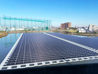 Closeup a large-scale floating solar power plant, also known as a floatovoltaic system, installed...