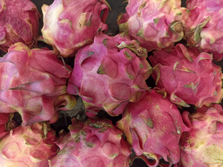 a bunch of red dragon fruit
