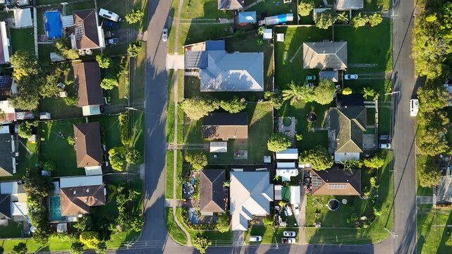 Ellen Grove, Brisbane, Queensland, Australia: 4K Aerial Image of Low Density Housing with Solar, Tree Lined Streets, Suburban Layout, Residential Zone, and Urban Green Space in Brisbane Western