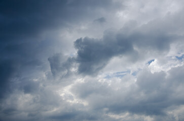 Sky with dark clouds and sun rays