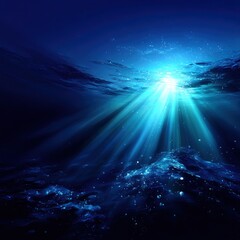 Underwater sunbeams illuminate dark seabed
