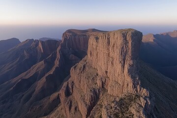 Dramatic mountain peak at dawn.  Atop a rugged, rocky landscape