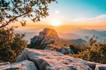 Majestic sunset over mountain peaks.  Rocky summit bathed in golden light