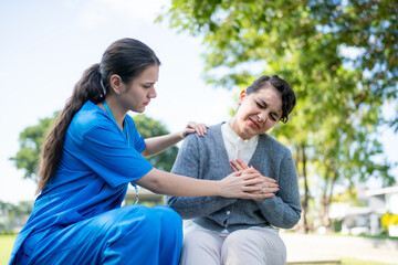 Outdoor home nurse comforting elderly woman