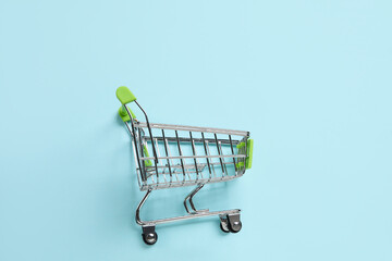 Shopping cart on blue background