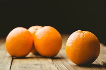 Close-up of oranges on wooden table