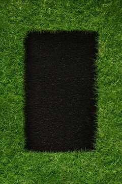 Black square inside green grass