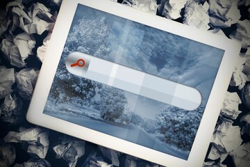 Tablet with search bar on crumpled up paper