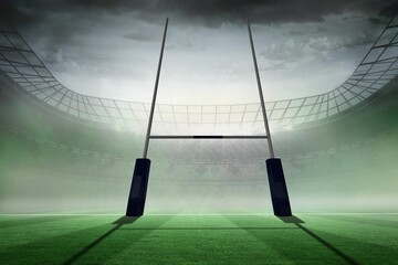 rugby goalpost is standing on green turf in flat design stadium, with misty stands and floodlights
