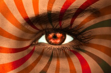 Orange eye on patterned face