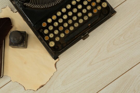 Typewriter and stamp on table