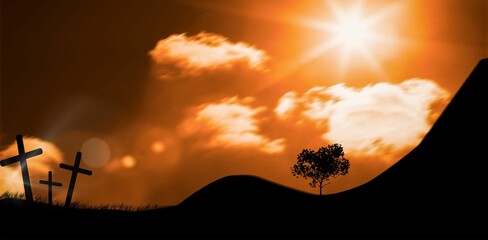 Cross religion symbol shape over sunset sky