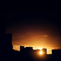 Silhouette buildings during sunset