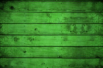Vector design is showing horizontal green wooden planks with weathered grain knots and blur effect