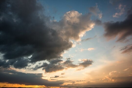 Fototapeta Blue and orange sky with clouds