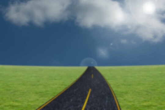 Fototapeta Road by grass field against sky