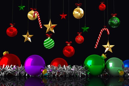Naklejki Flat design holiday baubles, candy canes and stars are hanging over tinsel against black backdrop