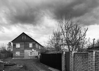 Wooden old barrack-type house, old housing in a big city