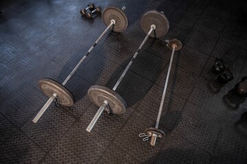 Barbells on floor in fitness studio