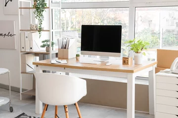 Gardinen Blank computer monitor with folders and plants near window in office © Pixel-Shot