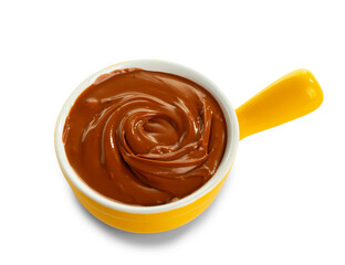 Bowl of sweet melted chocolate on white background