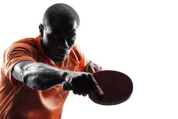 Focused male table tennis player in orange shirt hitting ball with paddle isolated on transparent background