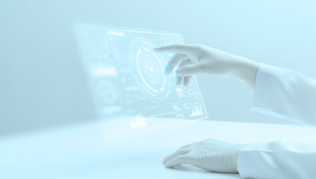 Gloved hand interacts with a transparent holographic display in a futuristic clinical setting, showcasing innovation in healthcare technology and virtual interfaces.
