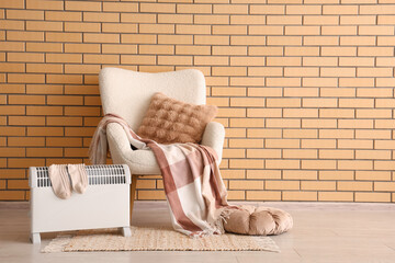 Interior of stylish living room with modern convector heater and cozy white armchair