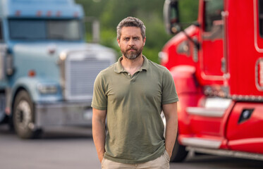 Man trucker driver near lorry truck. Transportation vehicles. Semi trucks vehicle. Hispanic man...