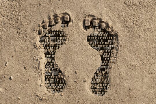 Digital Footprint in Sand: Binary Code in Footprints on Beach - Conceptual Image for Technology, Data, and Digital Presence
