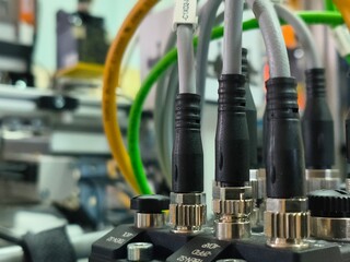 Close-Up of Industrial Cables and Bayonet Connectors on Equipment