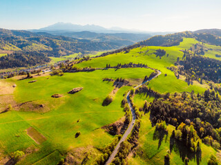 Mountain scenery with pastures and High Tatras mountains in the background. Pieniny mountains in...