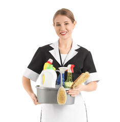 Pretty chambermaid with cleaning supplies on white background
