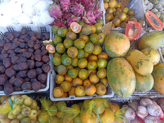 a bunch of fruit in a basket for sale at the market