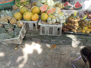 a bunch of fruit in a basket for sale at the market