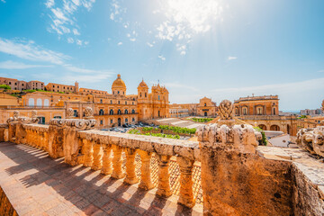 view in Noto, with the Basilica Minore di San Nicolo and Palazzo Ducezio, Sicily, Italy. Chiesa di...
