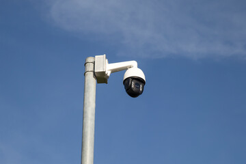 CCTV camera with blue sky as background
