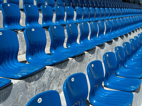 lots of plastic seats for spectators in the stadium