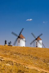 Fototapeta premium Traditional windmills standing on a hill in Mota del Cuervo, Spain